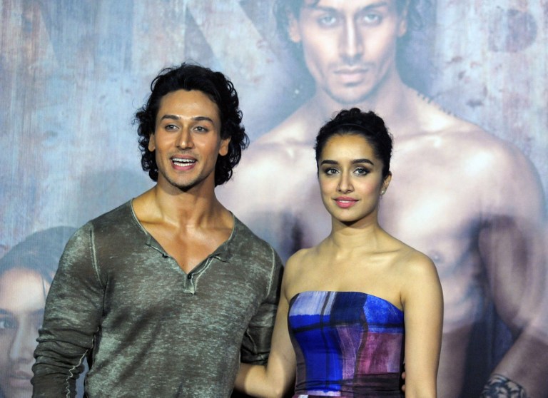 Indian Bollywood actors Tiger Shroff (L) and Shraddha Kapoor attend the trailer launch of the upcoming Hindi film Baaghi in Mumbai on March 14, 2016. / AFP