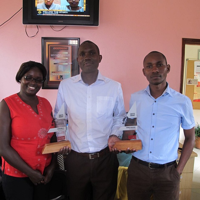 Musoke (RIGHT) is Uganda's best. Here he hands Managing Editor Joseph Were a trophy last year.