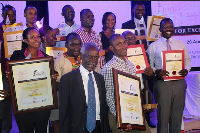 Ronald Musoke of the Independent (overall winner of ACME awards) with Chief Guest Justice James Ogoola and other winners