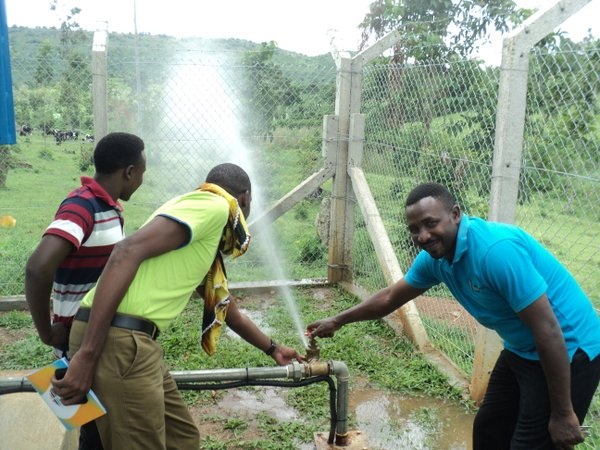 Water gashes out of the new pipes in Rwebishahi