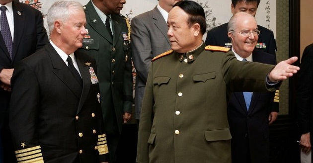 US commander of the Pacific Fleet Admiral Timothy Keating is welcomed by Chinese General Guo Boxiong (right) upon arrival at the Ba Yi building in Beijing, January 14, 2008 AFP FILE PHOTO 