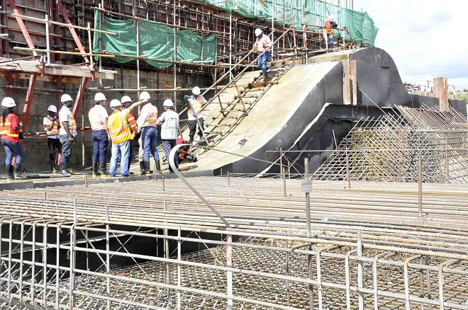 Engineers at the Karuma hydro Power dam inspecting the cracks at the Spillway which has caused a lot of controversy.