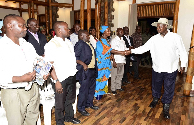 President Museveni (R) meeting opposition leades