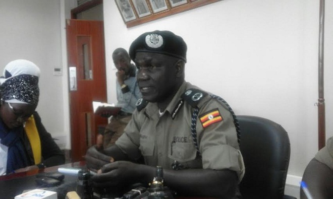 Policeman Mugisa briefs press on floods and goons situation. PHOTO BY CHARLOTTE NINSIIMA