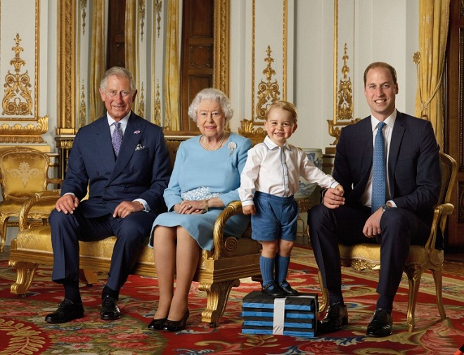 A handout image released shows (L-R) Britain's Prince Charles, Prince of Wales, Britain's Queen Elizabeth II, Britain's Prince George, and Britain's Prince William, Duke of Cambridge smiling during a photo shoot for the Royal Mail in 2015 in the White Drawing Room at Buckingham in London. 