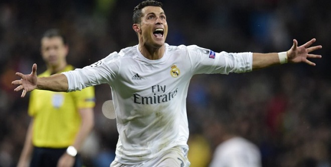 Real Madrid's Portuguese forward Cristiano Ronaldo celebrates after scoring his third goal  April 12, 2016. / AFP 