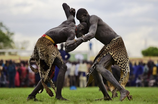 Wrestlers from Jonglei and eastern lakes region take part in the South Sudan National Wrestling Competition for peace at Juba Stadium, South Sudan, on April 20, 2016. AFP PHOTO