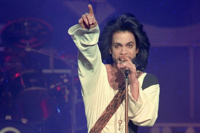 This photo taken on June 16, 1990 shows musician Prince performing onstage during his concert at the Parc des Princes stadium in Paris. AFP Photo