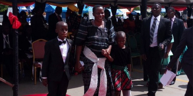 MP Betty Nambooze heads to the podium to swear in