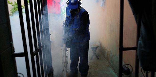 Fumigation key to fighting mosquitoes. Above a child's head is measured to check for signs of Zika. WHO PHOTOS