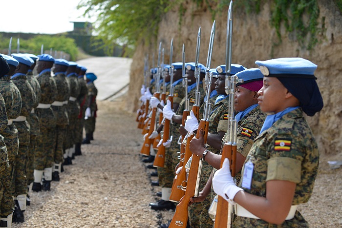 Officers and men of the United Nations Guard Unit from the UPDF mount a guard of honour during a medal awards ceremony held in Mogadishu, Somalia on June 26, 2016. ALL AMISOM PHOTOS/Omar Abdisalan