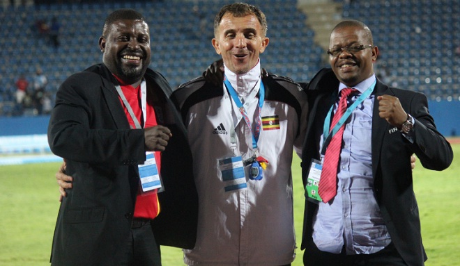 Cranes officials, team leader Dennis Mbidde, coach Micho and FUFA president Magogo celebrate in Botswana. PHOTO BY FUFA