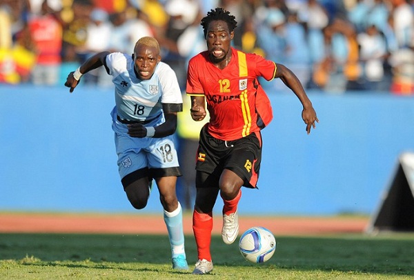 Uganda's defender Denis Iguma (R) evades Botswana's midfielder Lebogang Ditsile during the AFCON 2017 qualifying match Botswana vs Uganda at the Francistown stadium in Botswana on June 4, 2016. AFP PHOTO