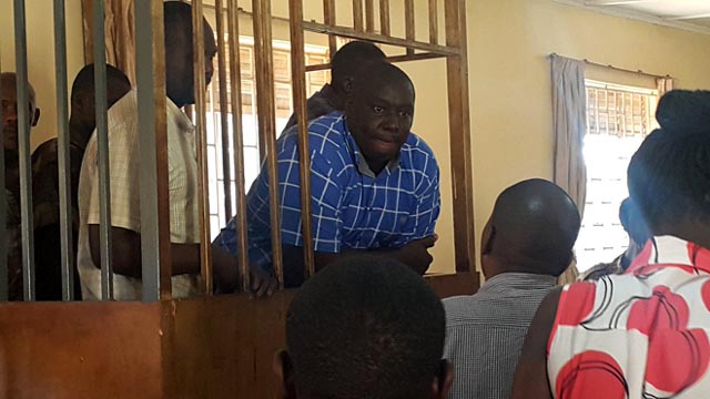 Kabaziguruka with his co-accused in the dock at the Army Court in Makindye. Photo via @Snduhukire