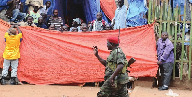 A Military Police officer tries to calm down vendors in Owino Market during a demonstration in Kampala. Most of the time, soldiers work in stressful situations which takes a heavy toll on their mental health. INDEPENDENT/JIMMY SIYA