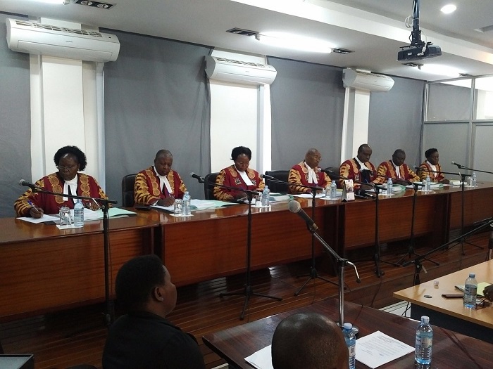 Justice Jotham Tumwesigye (centre) reads the full judgment today. COURTESY PHOHTO