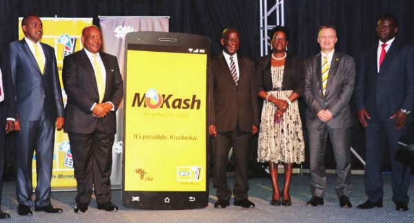 (L-R ) ICT Minister Frank Tumwebaze, MTN Uganda Chairman Charles Mbire, and the Vice President Edward Sekandi. Others are BOU’’s Justine Bagyenda, MTN CEO Wim Vanhelleputte and CBA CEO Samuel Odeke during the launch of MTN’S MoKash on Aug 09. Courtesy photo