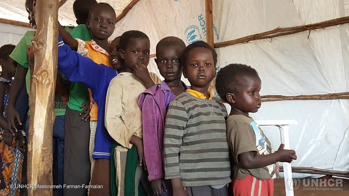 Youngest first! Children, refugees from #SouthSudan, line up patiently for medical examinations in Koluba Transit Centre Uganda, after which they will be relocated to Yumbe. PHOTO UNHCR