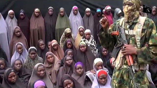 FILE PHOTO: Some of the Chibok girls under guard by rebels