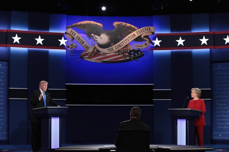 HEMPSTEAD, NY - SEPTEMBER 26: Republican presidential nominee Donald Trump (L) speaks as Democratic presidential nominee Hillary Clinton and Moderator Lester Holt listen during the Presidential Debate at Hofstra University on September 26, 2016 in Hempstead, New York. The first of four debates for the 2016 Election, three Presidential and one Vice Presidential, is moderated by NBC's Lester Holt.   Drew Angerer/Getty Images/AFP