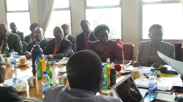 Dr.Jane Ruth Aceng and Sarah Opendi Achieng face the Health Committee chaired by Bukuya Mp Dr.Michael Yiga Bukenya. PHOTO GODFREY SSALI