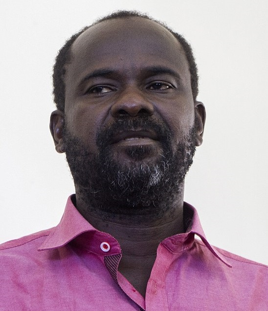 Ugandan Allied Democratic Front (ADF) rebel leader Jamil Mukulu is arraigned on July 12, 2015 before the media in Jinja. The 51 year old, suspected rebel has been a wanted man in Uganda for a range of crimes including terrorism and murder. Uganda accuses the rebel group of links to Somalias Al-Shabaab and Al-Qaeda. The ADF rebels launched an insurgency against President Yoweri Museveni in the early 1990s and later established bases in Congo. The rebel group is accused of murdering hundreds of people in a string of massacres in Uganda and the neighbouring Democratic Republic of Congo (DRC). AFP PHOTO/ ISAAC KASAMANI / AFP PHOTO / ISAAC KASAMANI