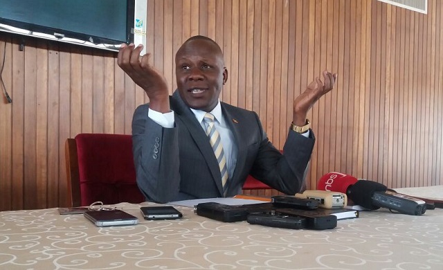 Ssekitoleko talking to the press at parliament on Thursday. PHOTO BY GODFREY SSALI