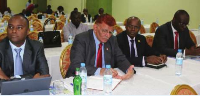 (L-R) Patrick Mweheire MD Stanbic Bank, Ashok Kumar Garg MD Bank of Baroda, Harman Kasekende MD Stanchart Bank and Julius Kaketo MD Orient Bank, Banking Association's Wilbrod Owor listen to a presentation during a meeting between Uganda Bankers Association and Members of Parliament at Imperial Royale Hotel. independent Photo/Patrick Kagenda