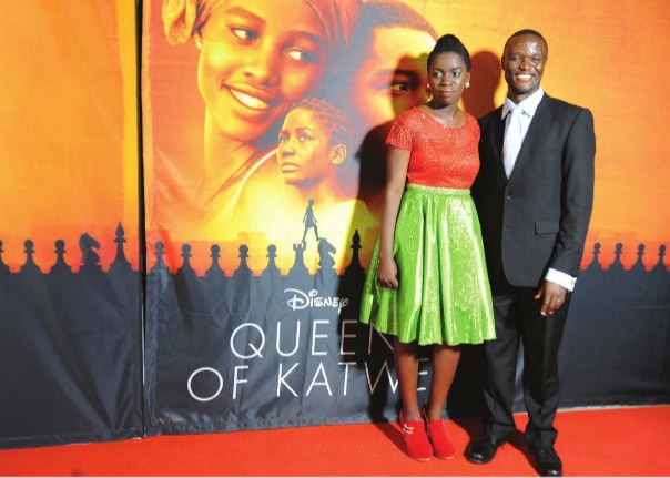 Phiona Mutesi, on whom the film 'Queen of Katwe' is based and Robert Katende, the man who taught her chess, at the premiere in Kampala. Independent/Jimmy siya