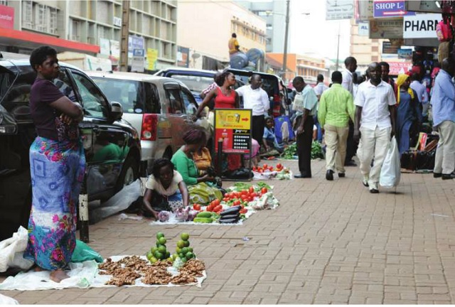 Vegetable vendors selling along Luwum Street in Kampala on Oct. 17. KCCA has gazetted Namirembe road, Nakivubo mews for vendors till when they are relocated. INDEPENDENT/JIMMY SIYA