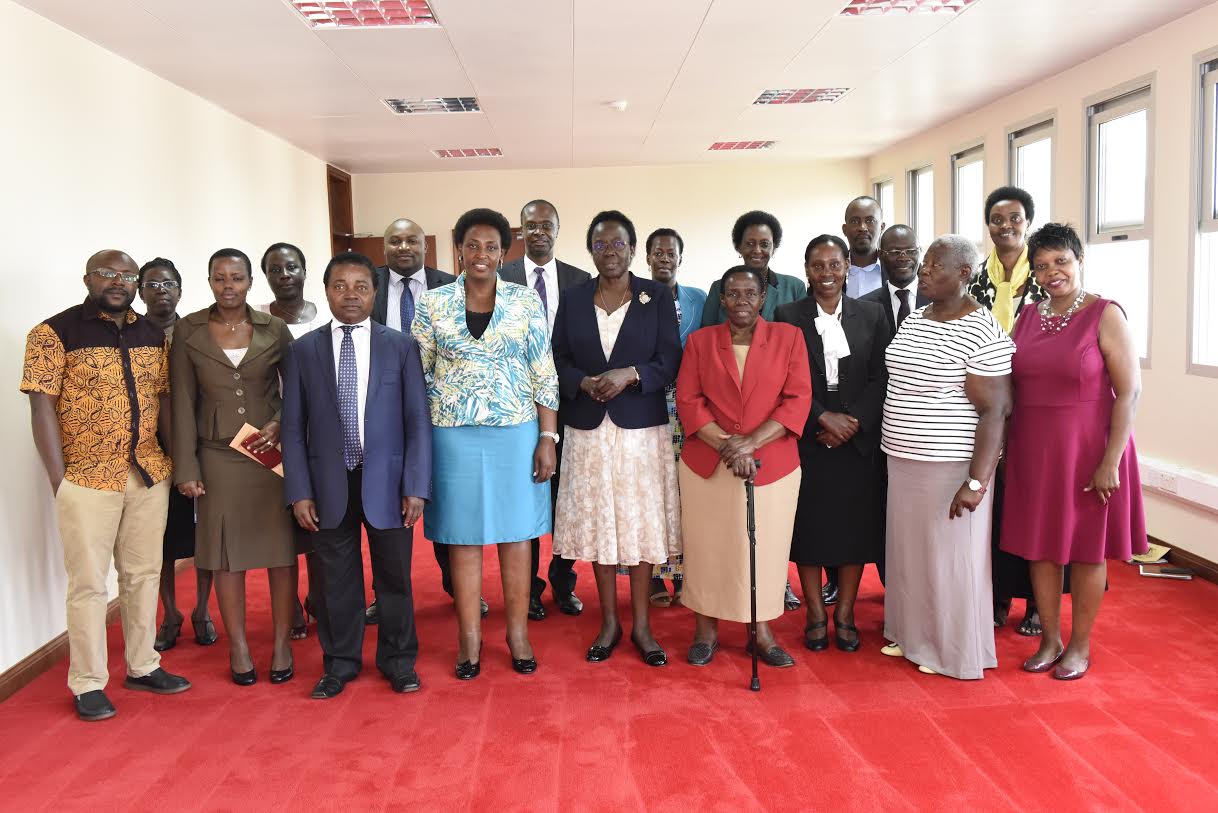 The New PPS Molly Kamukama with heads of units of State House at the Handover ceremony that happened this morning at President's Office, Parliament 2. The Outgoing PPS Mary Amajo hands over a report to the Incoming PPS Molly Kamukama. Looking on - Undersecretary for Finance and Administration of State House Hope Nyakairu, The Head of Economic Monitoring Unit Stephen Miyingo and the Asst. Commissioner for Human Resource Ronald Kiberu