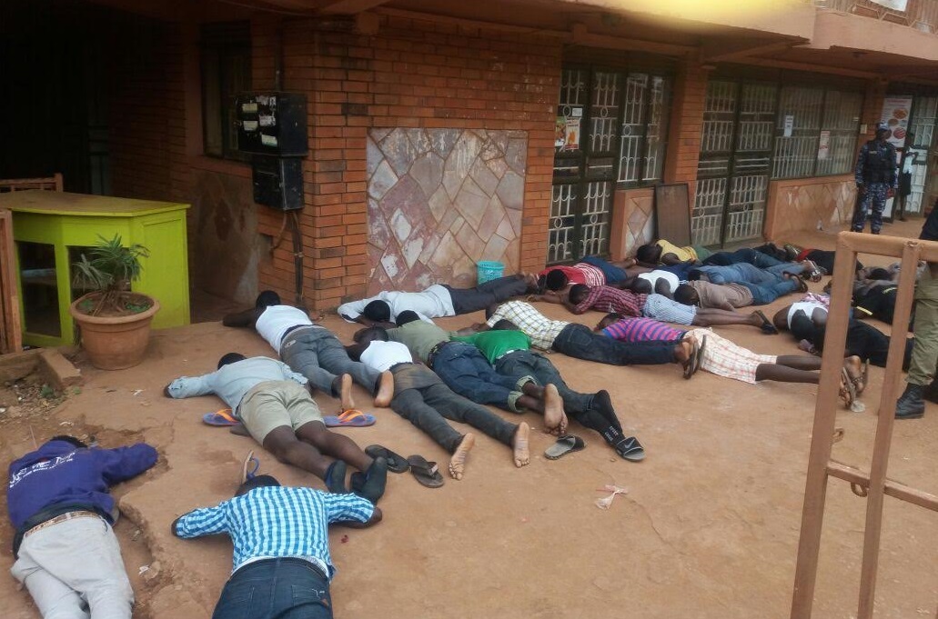 The striking Students from Douglas Villa Hostel ordered to lie down low like envelopes by the Military Police. PHOTO GODFREY SSALI