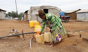 In DRC displacement camp, Ebola warnings meet dry taps, crowded shelters