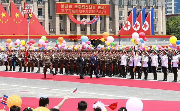 Xi arrives to grand welcome in Pyongyang for state